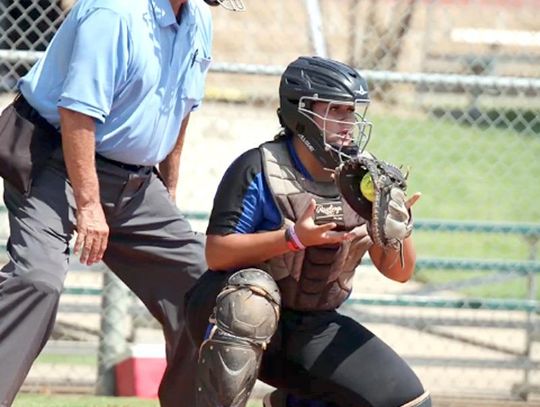 Catcher Lilyana Portillo surveys the field after a pitch during this weekend’s Lincoln-Christian