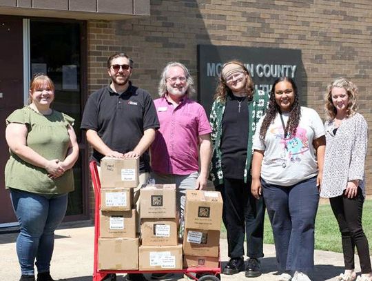 Pioneer Library System donated books for reaching Summer Learning Challenge goal