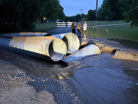 Water cuts through E. Fox Lane ... three times