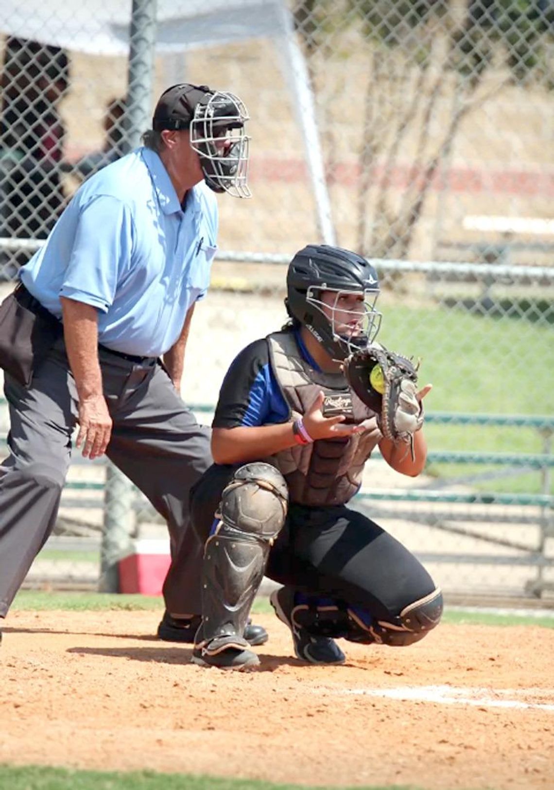 Catcher Lilyana Portillo surveys the field after a pitch during this weekend’s Lincoln-Christian