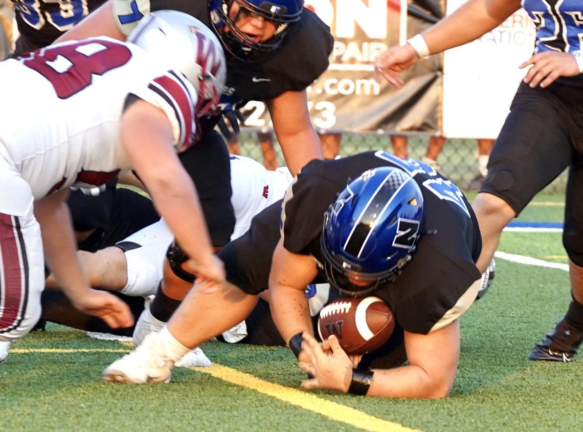 Jaron Webb falls on the loose ball for the Racers during the Weatherford game