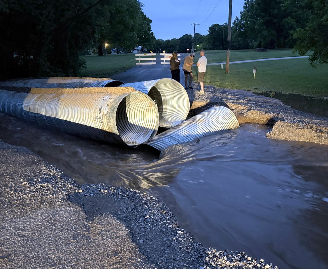 Water cuts through E. Fox Lane ... three times