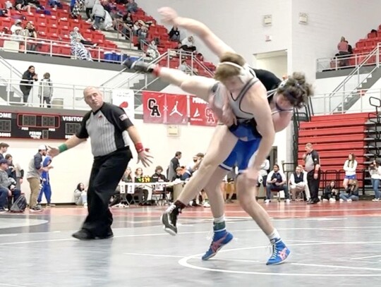 Max Rinehart tosses an opponent around at the Carl Albert Tournament. Rinehart had a sixth place finish for Newcastle. • photo provided