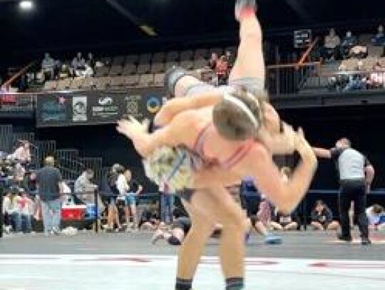 Shane Lovejoy takes down one of his Conference Wrestling opponents on the way to a third-place win. • photo provided