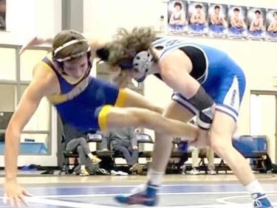 Hayden McKinney, 157 (photo left), and Max Rinehart, 150 (photo right) handle their opponents during the Racers’ Senior Night dual with Piedmont. The match gave Coach Zach Hale an idea of how the Racers would compete in Class 5A. • photos provided