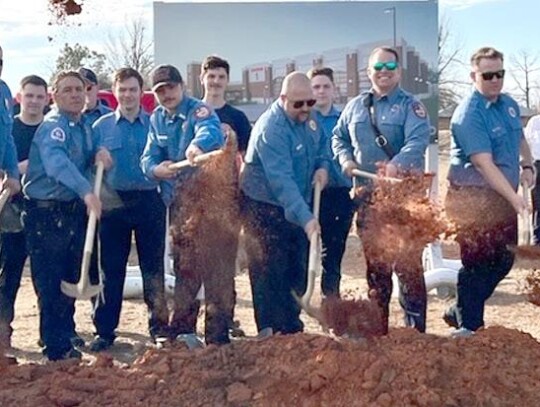 Newcastle firefighters take part in breaking ground for construction of their new home-away-from-home at 555 S. Main. Construction on Fire Station #1 is expected to take about one year. • photo provided