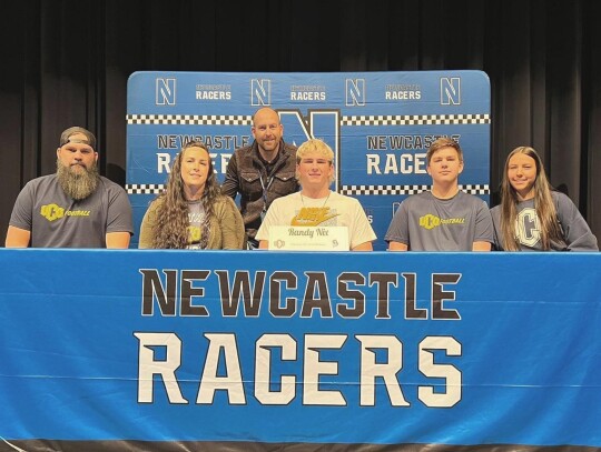 Randy Nix, Jr., signs with the University of Central Oklahoma in Edmond to play football.