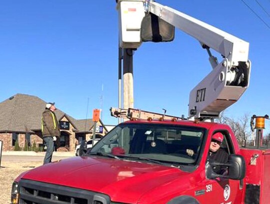 When the City’s bucket truck was down, Pioneer Telephone aided the Parks &amp; Recreation Department taking down Christmas decorations. • photo provided