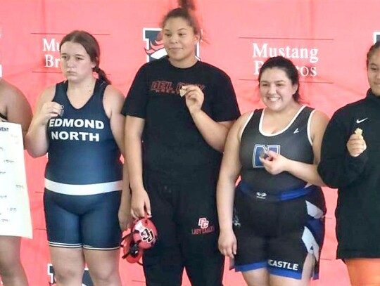 Estrada is off to State Tourney Aundrea Estrada (second from right) placed fourth at Regionals last week and will be wrestling for Newcastle at the State Tournament. • photo provided