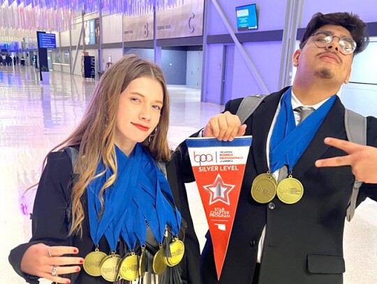 Kendall Edelen and Neftali Baquera display the BPA Silver Chapter Award and some of the medals brought home by MATC students. • photo provided