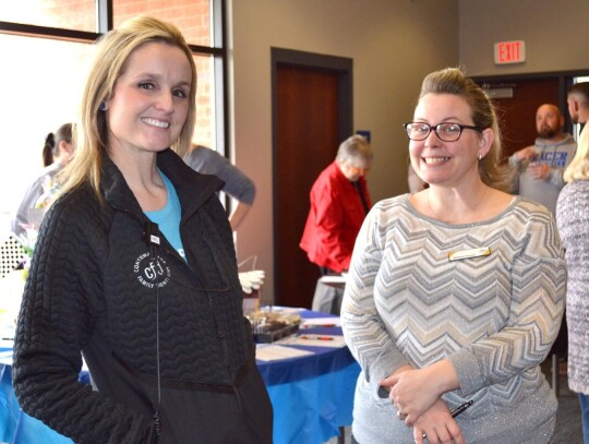 Melissa Crain of Contemporary Family Dentistry and Brittany Houser of The First National Bank of Newcastle were among chamber of commerce members taking part in the Racers for Excellence scholarship fundraiser Tuesday, March 28 at the Newcastle Schools’