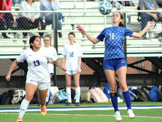 Newcastle junior Brynna Ford works the ball for the Racers during a recent soccer competition. • photo by Mindi Stucks