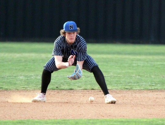 Sophomore Jackson Schanuel gets down for the ground ball for the Racers during a Newcastle game last week. • photo by Vickie Crossley