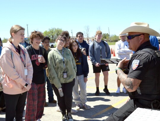 The Oklahoma County Sheriff’s Office provided information to Newcastle students about rollover crashes. Their rollover machine showed what happens to a dummy without a seat belt.