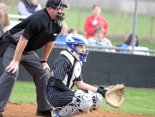 Racer catcher James Folsom calls the signals during the Newcastle-Bridge Creek Regional Tournament game. • by Vickie Crossley