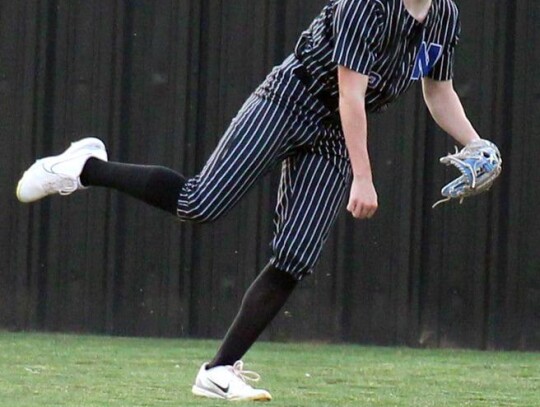 Logan Wade tosses the ball in after making a catch in the outfield for Newcastle. • photo by Vickie Crossley