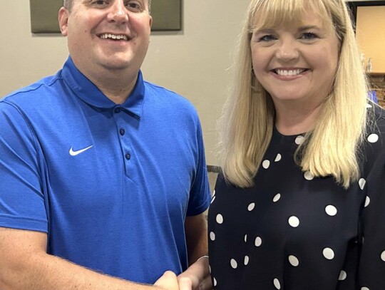 Hodges is new Athletic Director Former Moore coach Brent Hodges is pictured with Superintendent Dr. Cathy Walker after his approval for the Newcastle Athletic Director position. • photo by Mark Codner