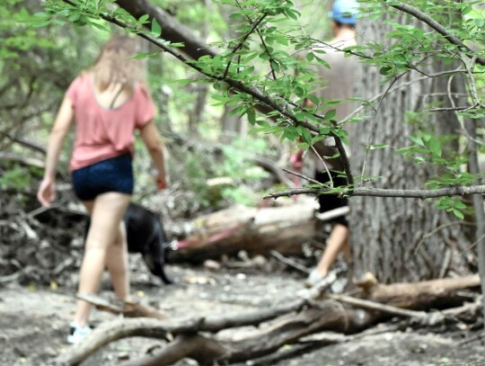 Anika Drew, left, and Nicholas Stone wander trails behind Woodward High School. • photo by Yasmeen Saadi | Oklahoma Watch