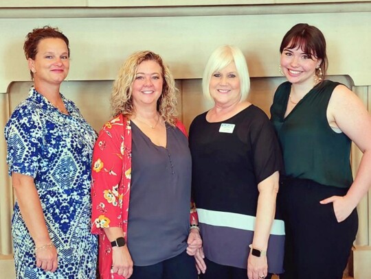 Taking the opportunity for a photo together are area Chamber representatives. They are: Cheryl Hendricks of Blanchard, Leslie Walker of Tuttle, Gayla Riddle of Newcsatle, and Madalyn Heathrow, Tuttle assistant. • photo submitted