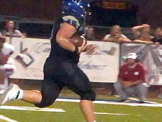 Jaron Webb runs one back for the Newcastle Racers during Friday night’s game against the Weatherford Eagles. • photo by Jennifer Lewis