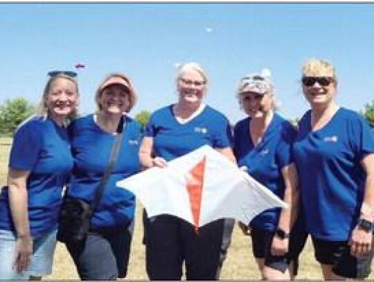 Kites and Bites flies high at Veterans Park Rotary Club International members from Newcastle volunteered to help out at this year’s Kites and Bites, put on by the City of Newcastle Parks Department. Pictured are: Tamara Holland, Teresa Crook, Kimberly S