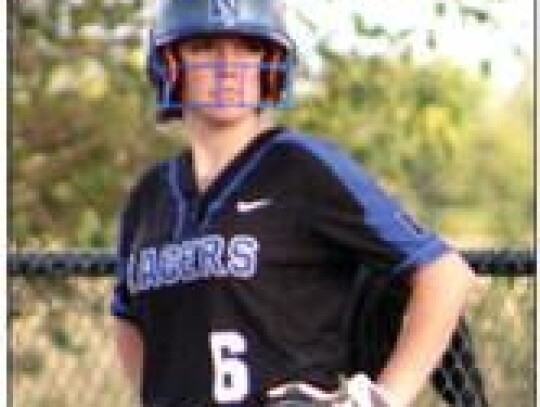 Addison McCann surveys the field while preparing to run the base path for the Racers. • photo by Lisa Smith-Longman