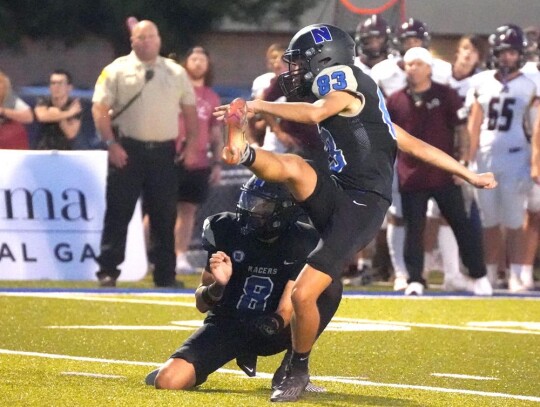 Kicker Toby Batchelder knocks in one of his two field goals for the night against Blanchard. • photo by Jennifer Lewis