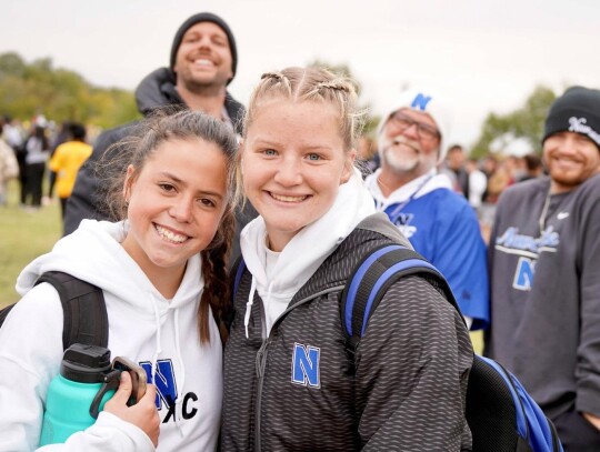 • photos by Jennifer Lewis Running at the State Cross Country Meet at Edmond Santa Fe High School on Saturday were Bella Allen and Addyson Bush. In back are Newcastle High School principal Adam Hull, and coaches Jerald Lewis and Colton Evans.