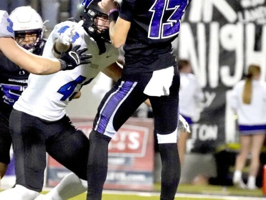 Ayden Elcyzyn pressures the Broncho quarterback on a pass play. • photo by Jennifer Lewis