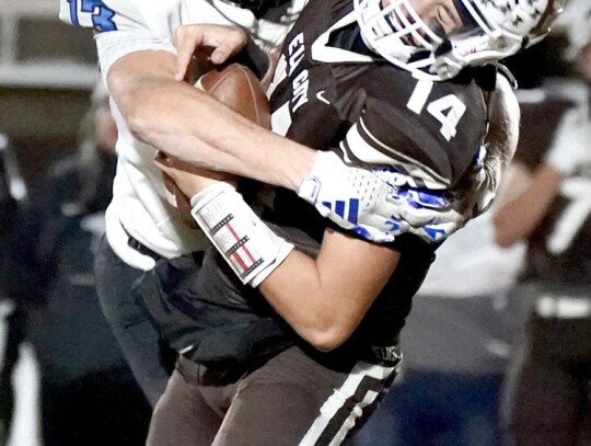 Senior Jackson Bergt makes the tackle for Newcastle during the first round State Playoff game against Elk City Friday night. • photo by Jennifer Lewis