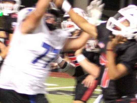 • photo by Lisa Smith-Longman Taj Smith puts the pressure on the Poteau Pirates quarterback during Newcastle’s State Playoff game Friday night.