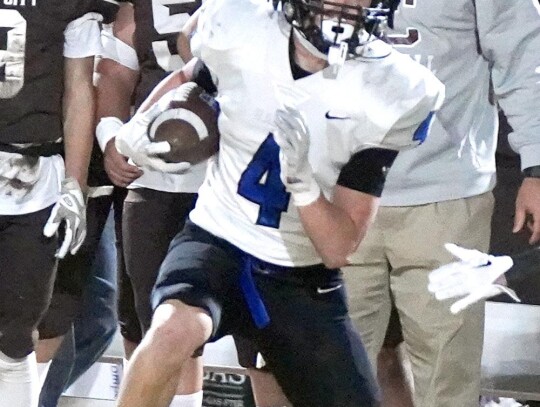 Rex Heskew takes the ball for the Racers during a playoff game at Elk City. • photo by Jennifer Lewis