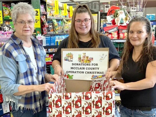 Operation Christmas donations Newcastle Dollar General employees Mikala Burley and Anna Forsyth along with McClain County Operation Christmas volunteer Peggy Christian are ready for donations. Monetary donations for Operation Christmas may be mailed to Da