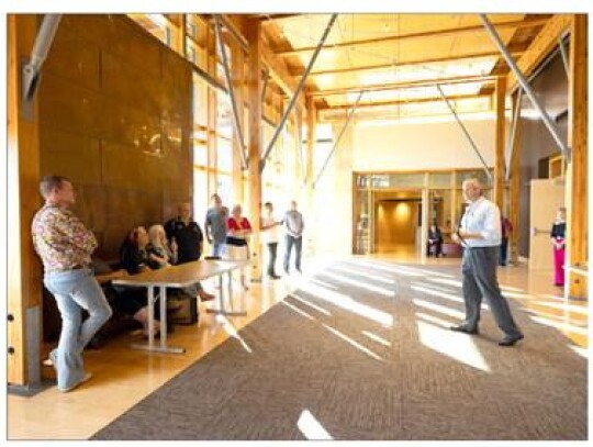 Chickasaw Cultural Center specialist Jason Burwell visits with the New Zealand tribal contingent and performs traditional First American hymns on a hand-carved First American flute.