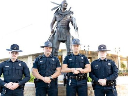 Chickasaw Lighthorse officers Tucker Pfeiffer, Harry Kelly, Gavin Aldridge and Jakub Sharp stand outside the Aiitafama' Ishto' (Large Gathering Place) in Tishomingo. Since being reestablished in 2004, the Chickasaw Lighthorse Police Department has grown t