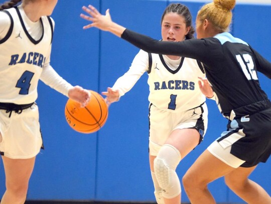 Senior Leah Bradley throws the ball to sophomore Reagan Greenroyd in a game this weekend during the Sweet Pea Invitational. • photo by Jennifer Lewis