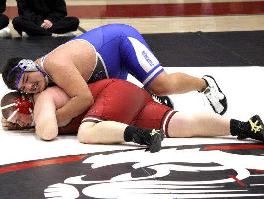 Heavyweight Nicolas Lozano keeps his Tuttle opponent to the mat during wrestling action for Newcastle last week. • photo by Valerie Dobbs