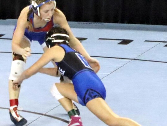 Newcastle 115 lb junior Trinity Duran took a shot against her opponent Lauren Mullin from Bixby. • photo by Ariadne Hale