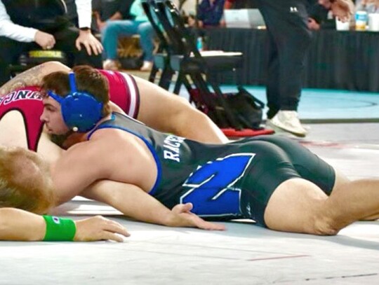 Newcastle 190 lb senior Shane Lovejoy pins his opponent Bryson Poindexter of Duncan. • photo by Ariadne Hale