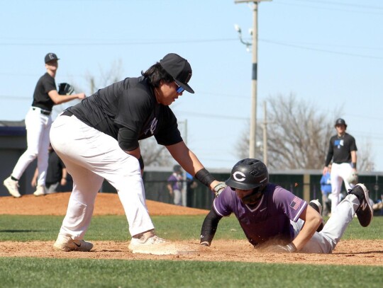 Taj Smith puts the tag on a Chickasha player in pre-season baseball for Newcastle. • photo by Lisa Longman-Smith