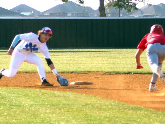 Newcastle shortstop Austin Gibson makes the play at second base for the Racers against Elgin. • photo by Lisa Longman-Smith