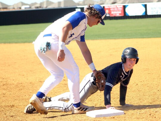 Jackson Schanuel goes for the tag on a base runner. • photo by Lisa Longman-Smith