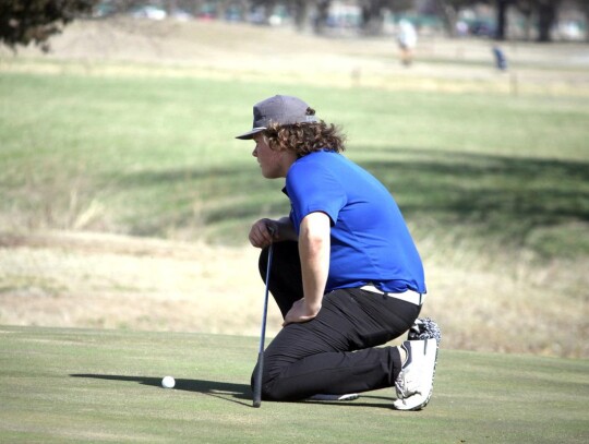 Bryson Furnish prepares to putt during a recent round of golf for Newcastle. • photo by Valerie Hobbs