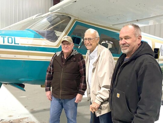 Paul Odom shows the variety of equipment and planes he uses and maintains with the help of his employees, Jeff White and Russell Wells. White has worked for Paul Odom for more than 40 years. • photo by Reed Boettcher