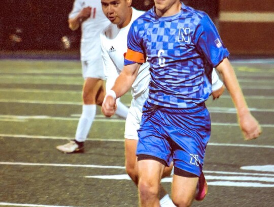 Caleb Dupler handles the ball for Newcastle. • photo by Mindi Stucks