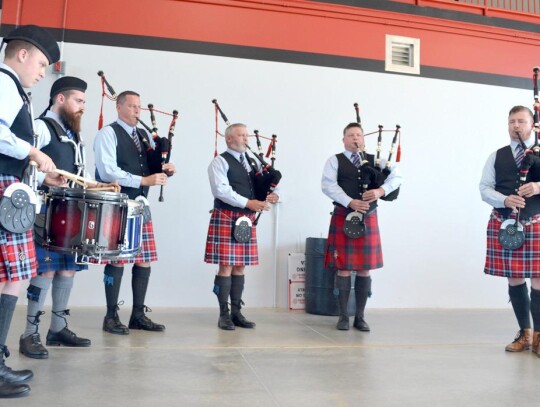 Performing their traditional music for the grand opening of Fire Station #1 in Newcastle is the Oklahoma Fire Pipes &amp; Drums of OKC. • photo by Mark Codner