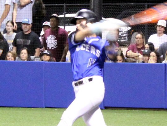 Austin Gibson meets a pitch during the Newcastle-Blanchard baseball game at the Baseball State Tournament. • photo by Lisa Smith-Longman