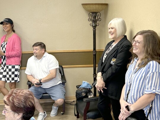 Enjoying the introduction of attendees at the Newcastle Chamber of Commerce Morning Mingle on Friday, from left, were: Robin Fielder of Pioneer, Billy Collier of First Christian Church, Chamber Executive Director/CEO Gayla Riddle, and Janelle Cottrell of 