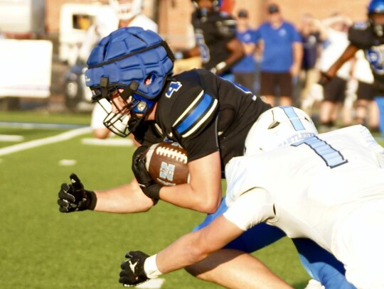 Senior Rex Heskew darts forward on a run for the Newcastle Racers during the season opener Thursday against the Bartlesville Bruins. The Racers won the outing 49-24. • photo by Jennifer Lewis